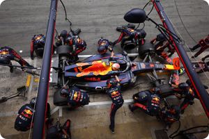 McLaren aerodynamicists studying Red Bull floor
